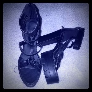 Open toed black pentagram platforms